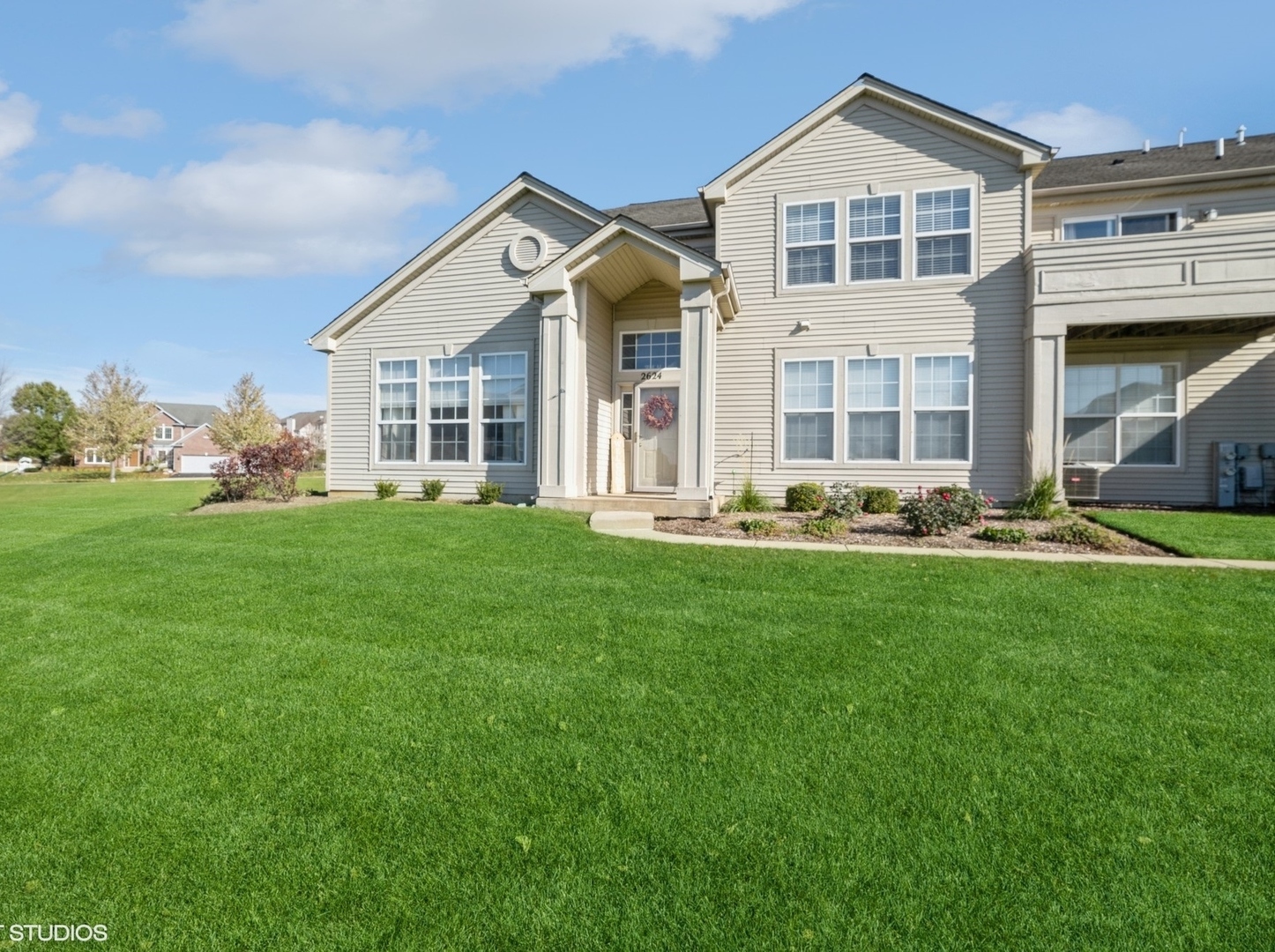 2624 Maple Circle West Dundee, IL 60118 - Photo 2 of 37 a front view of a house with a yard