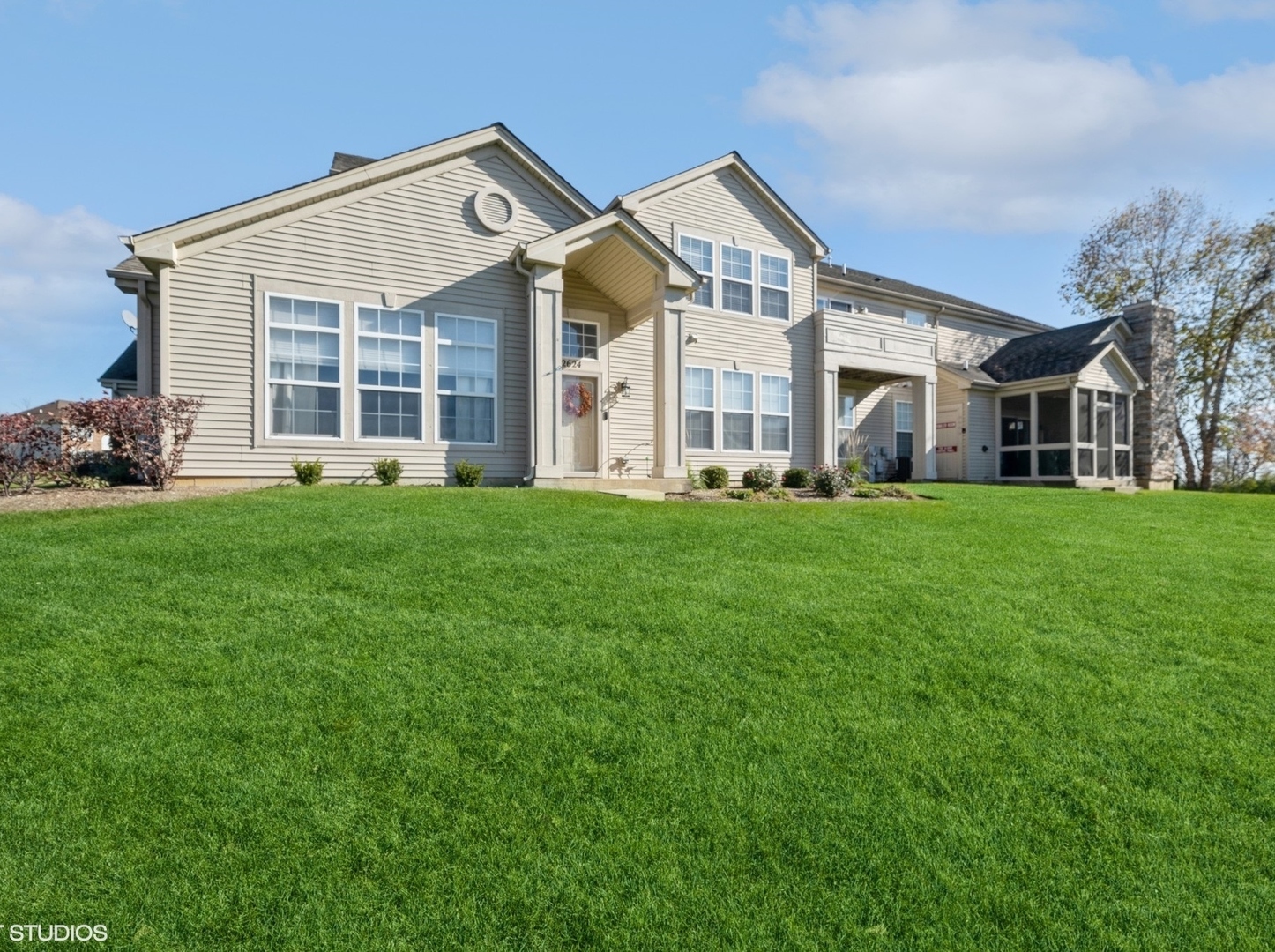 2624 Maple Circle West Dundee, IL 60118 - Photo 3 of 37 a view of a white house with a big yard and large trees
