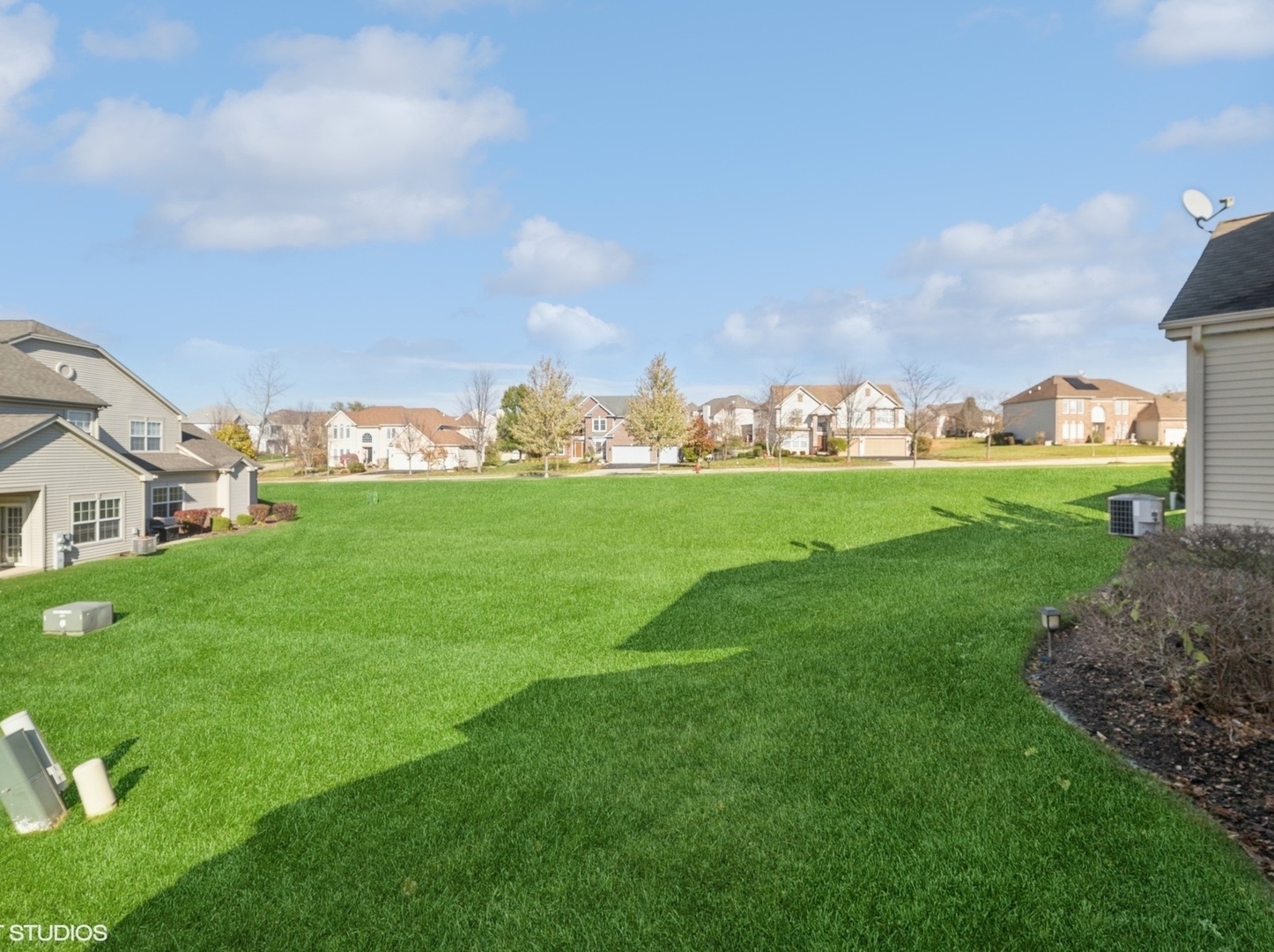 2624 Maple Circle West Dundee, IL 60118 - Photo 4 of 37 a view of a big yard with flower plants and a big yard