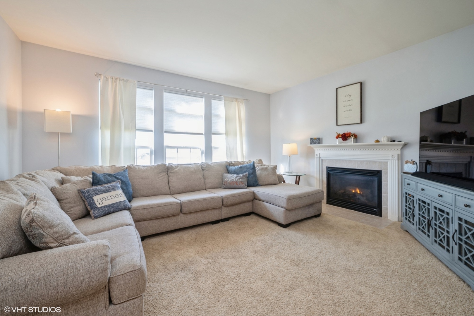 2624 Maple Circle West Dundee, IL 60118 - Photo 7 of 37 a living room with furniture a fireplace and a flat screen tv