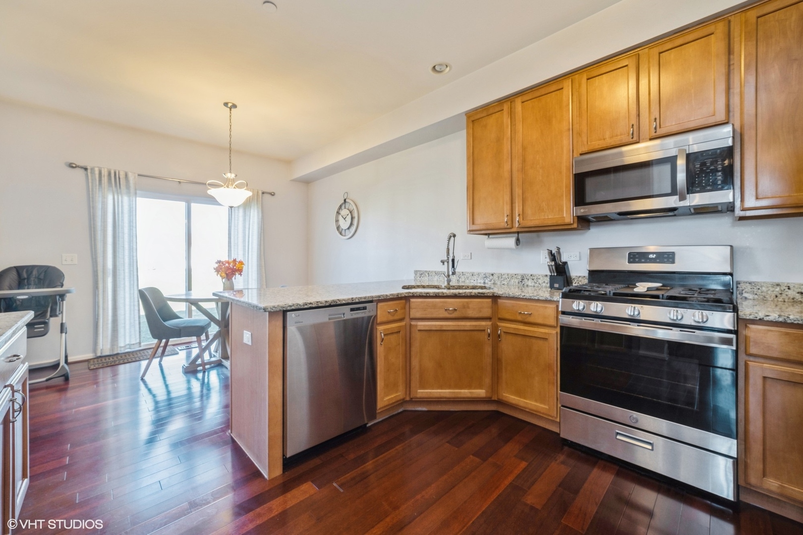 2624 Maple Circle West Dundee, IL 60118 - Photo 9 of 37 a kitchen with stainless steel appliances a stove a sink and a microwave