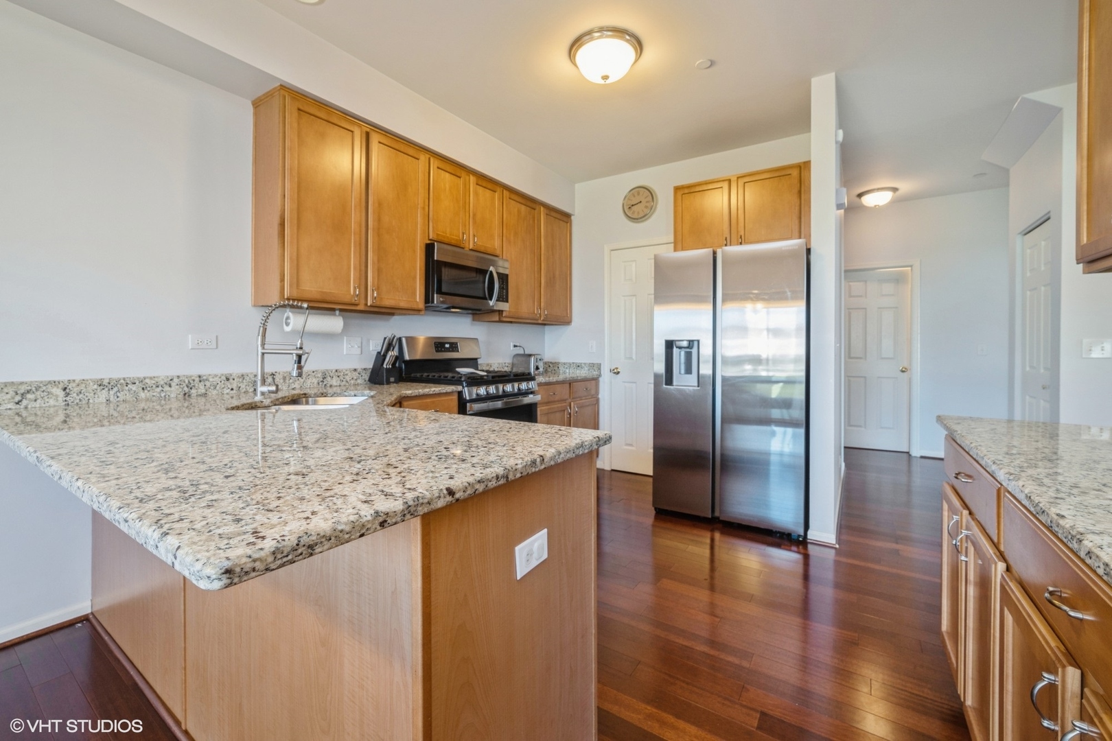 2624 Maple Circle West Dundee, IL 60118 - Photo 10 of 37 a kitchen with stainless steel appliances granite countertop a sink stove and refrigerator