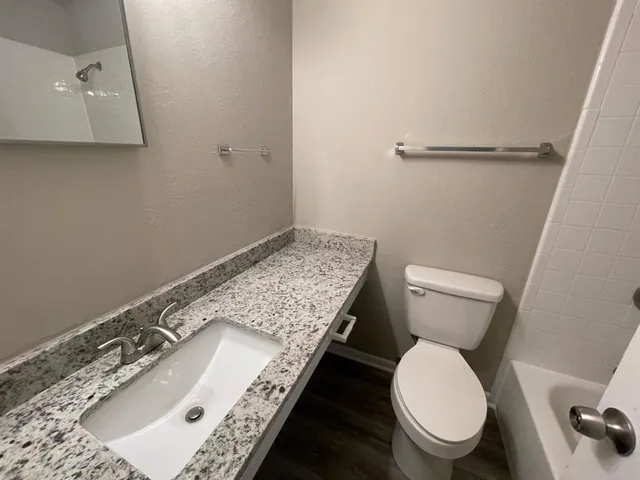 a bathroom with a sink and toilet