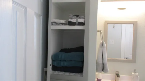 a bathroom with a sink and mirror