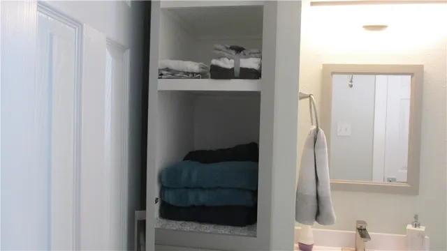 a bathroom with a sink and mirror