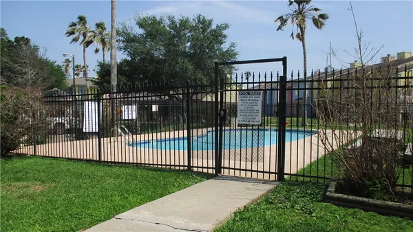 a view of a wrought iron fences in front of house