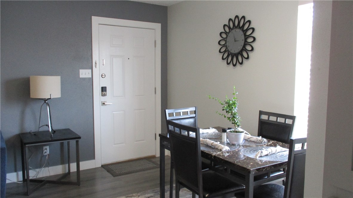 6702 Everhart Road, Unit H109 Corpus Christi, TX 78413 - Photo 10 of 18 a workspace with furniture and wooden floor