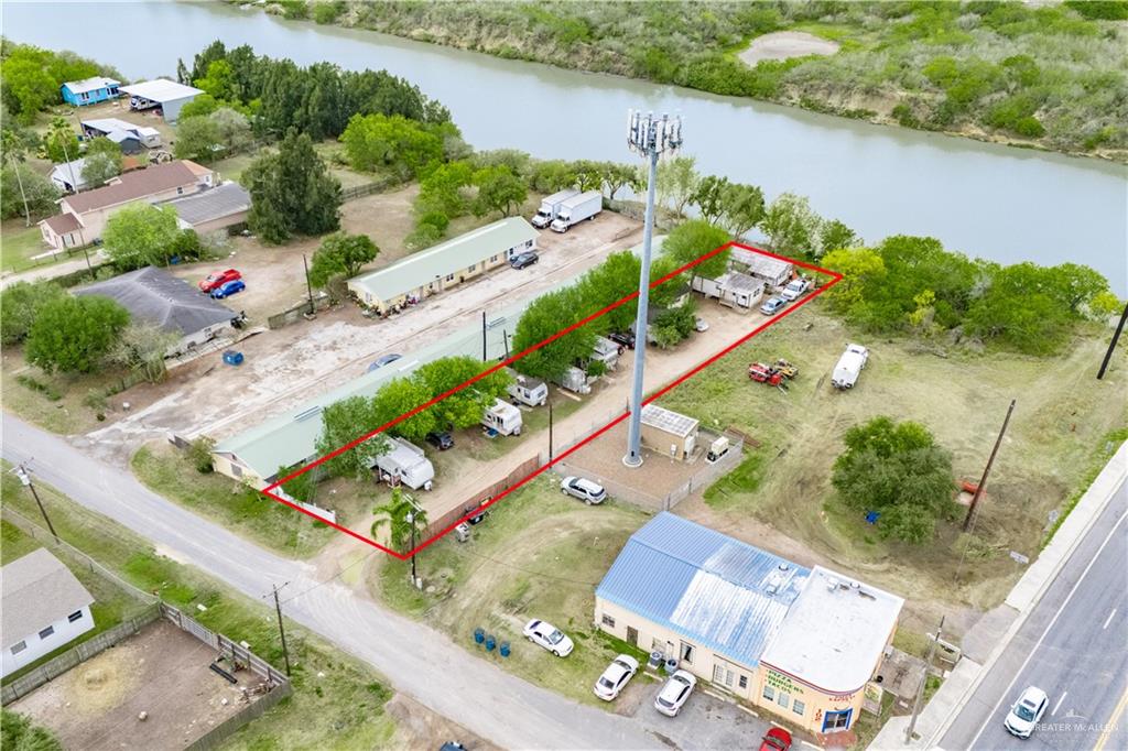 106 South Arroyo Boulevard Rio Hondo, TX 78583 - Photo 2 of 18 an aerial view of a house yard and lake view