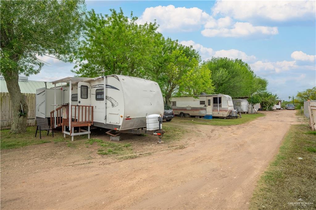 106 South Arroyo Boulevard Rio Hondo, TX 78583 - Photo 10 of 18 a white house that has a tree in front of it