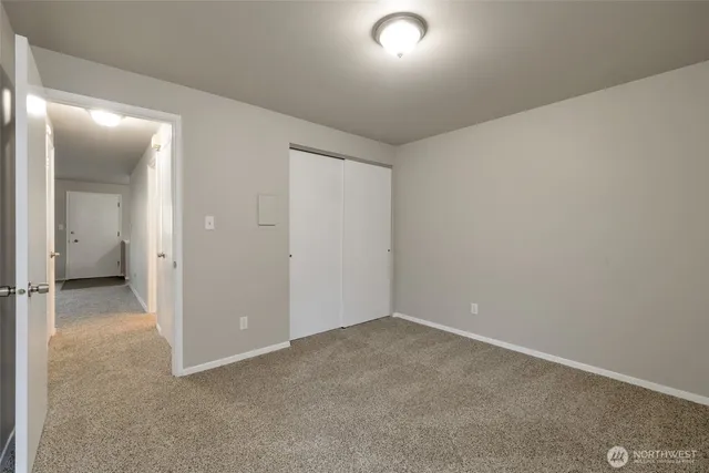 an empty room with a bathroom