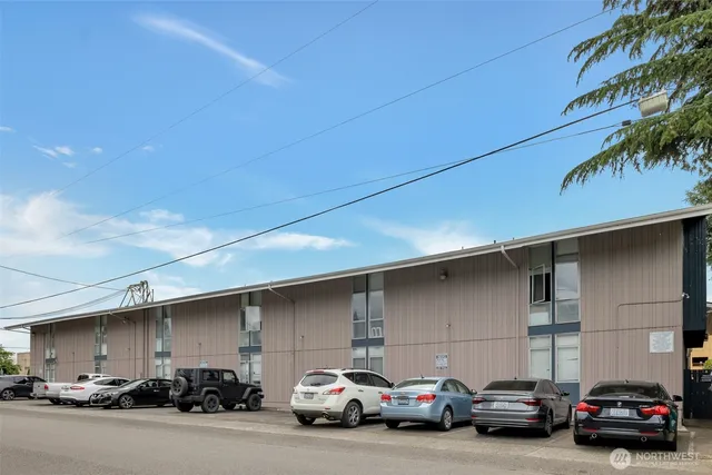 a couple of cars parked in parking area of a building