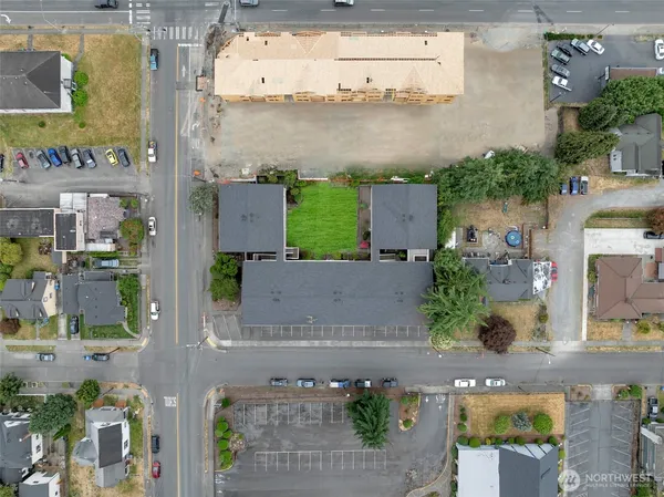 an aerial view of a house with a yard and a fountain