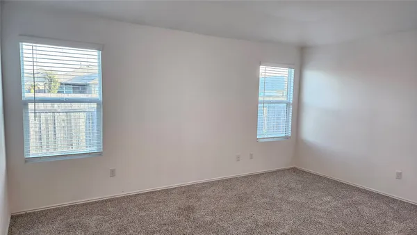 a view of a room with wooden floor and staircase