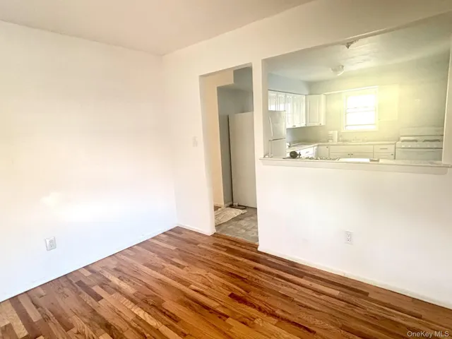 a view of a kitchen from the hallway