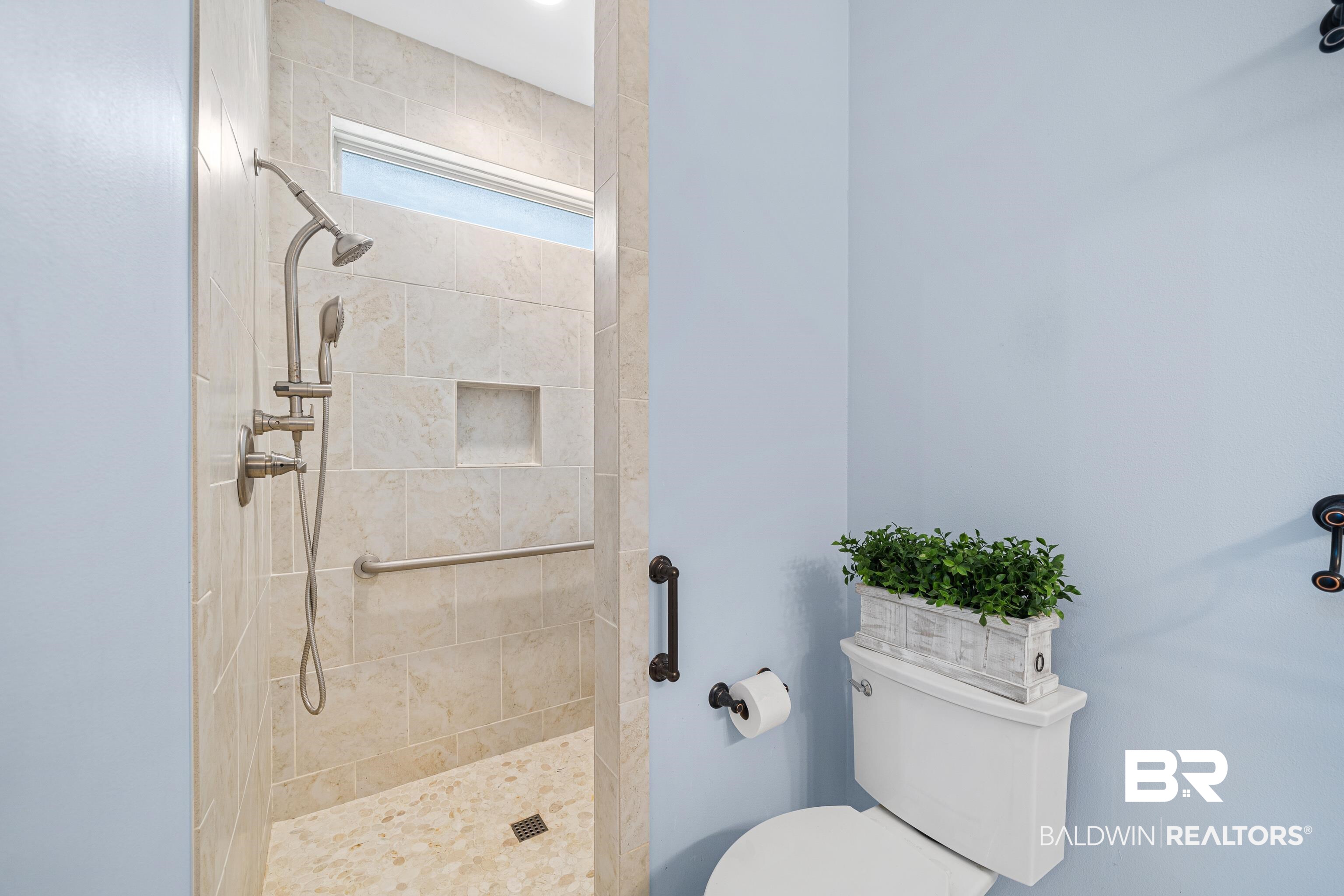36784 Legacy Way Bay Minette, AL 36507 - Photo 29 of 57 Main level Additional Suite Bathroom with Wide Doorways, single vanity and tiled shower.