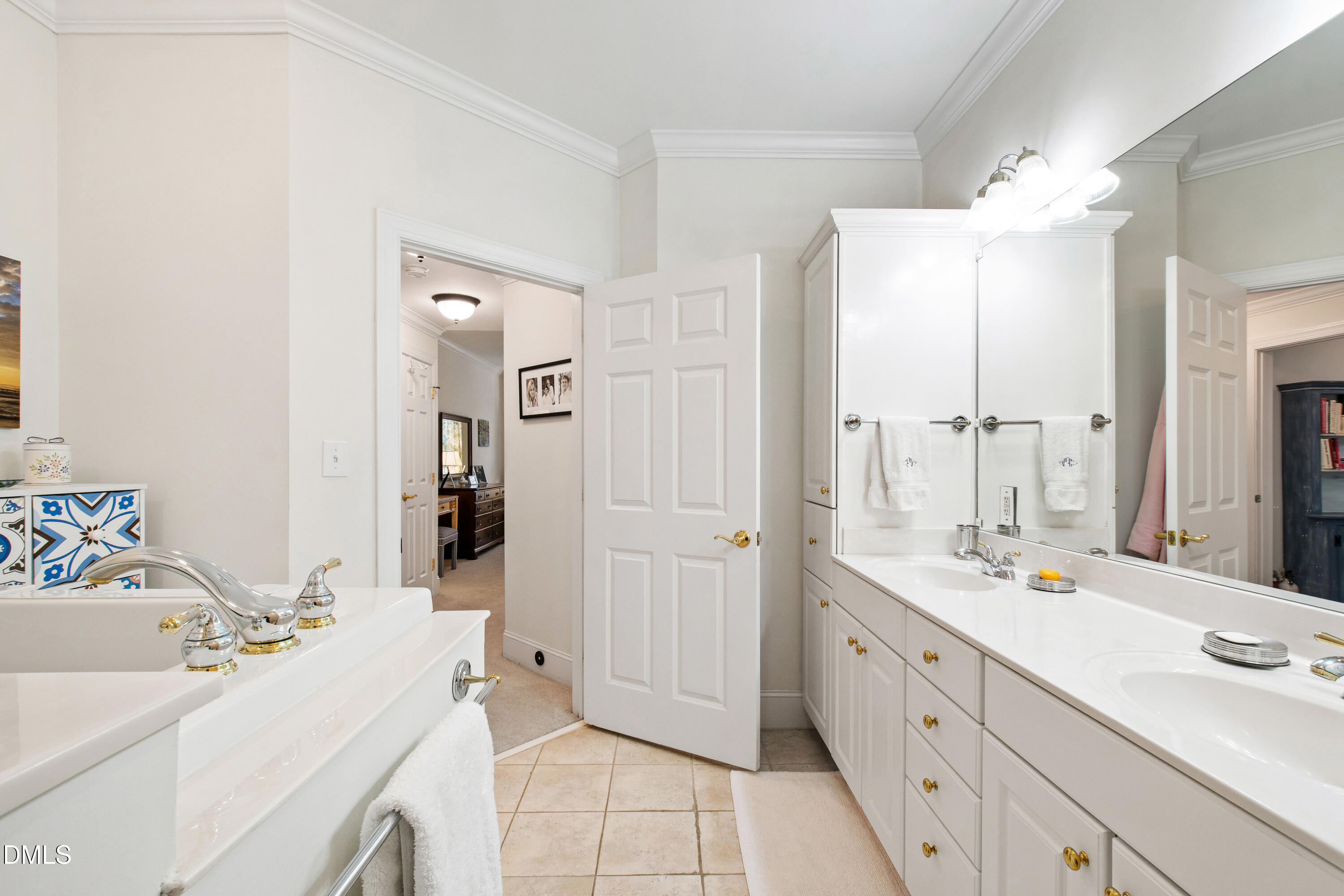3700 Baron Cooper Pass, Unit 105 Raleigh, NC 27612 - Photo 22 of 49 a spacious bathroom with a double vanity sink mirror and double