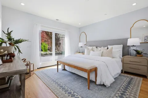 a bedroom with bed and a window