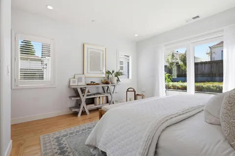 a bed room with a bed and a table