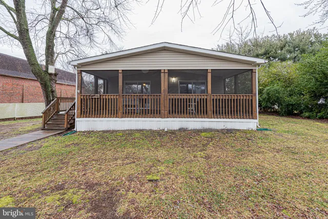 a house with trees in the background