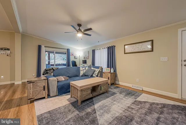 a bed room with furniture and a ceiling fan