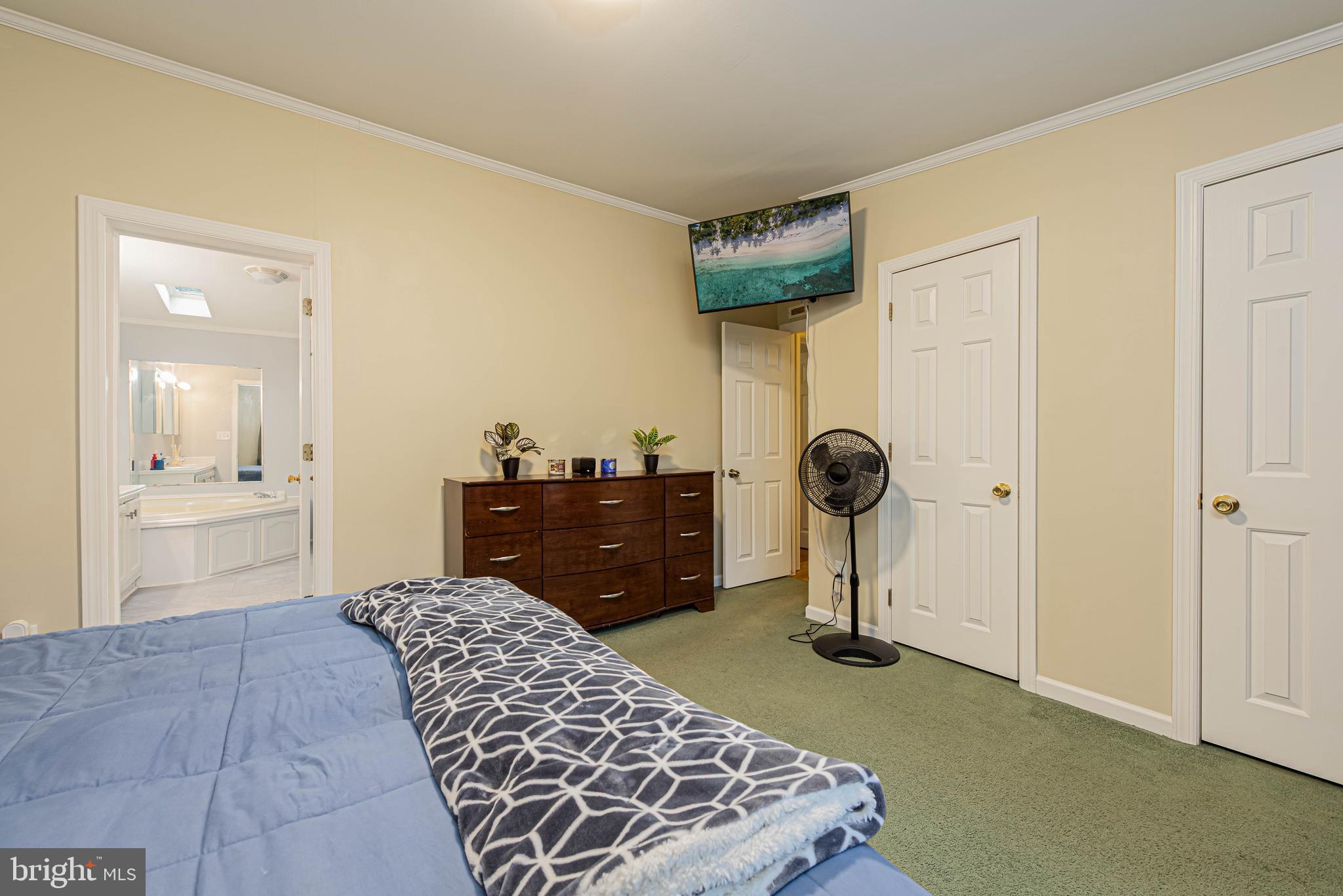 17282 Ridge Line Drive Lewes, DE 19958 - Photo 19 of 31 a bedroom with a bed and cabinets