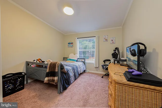 a bed room with a bed and a dresser