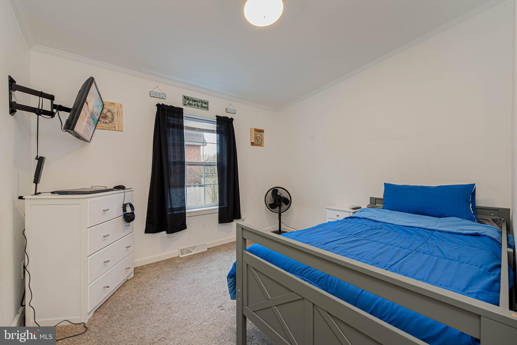 17282 Ridge Line Drive Lewes, DE 19958 - Photo 24 of 31 a bedroom with a bed and a dresser