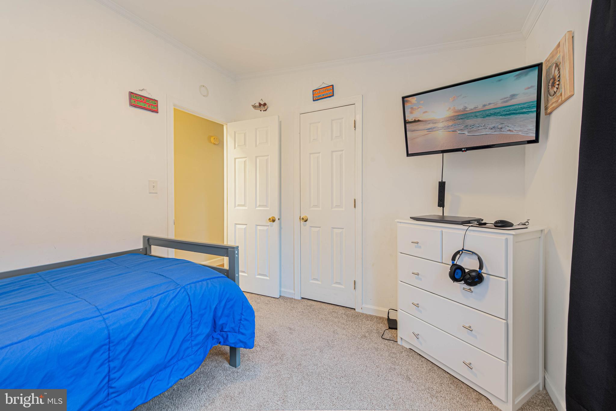 17282 Ridge Line Drive Lewes, DE 19958 - Photo 25 of 31 a bedroom with a bed and a dresser