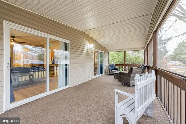 a view of living room with furniture and floor to ceiling window