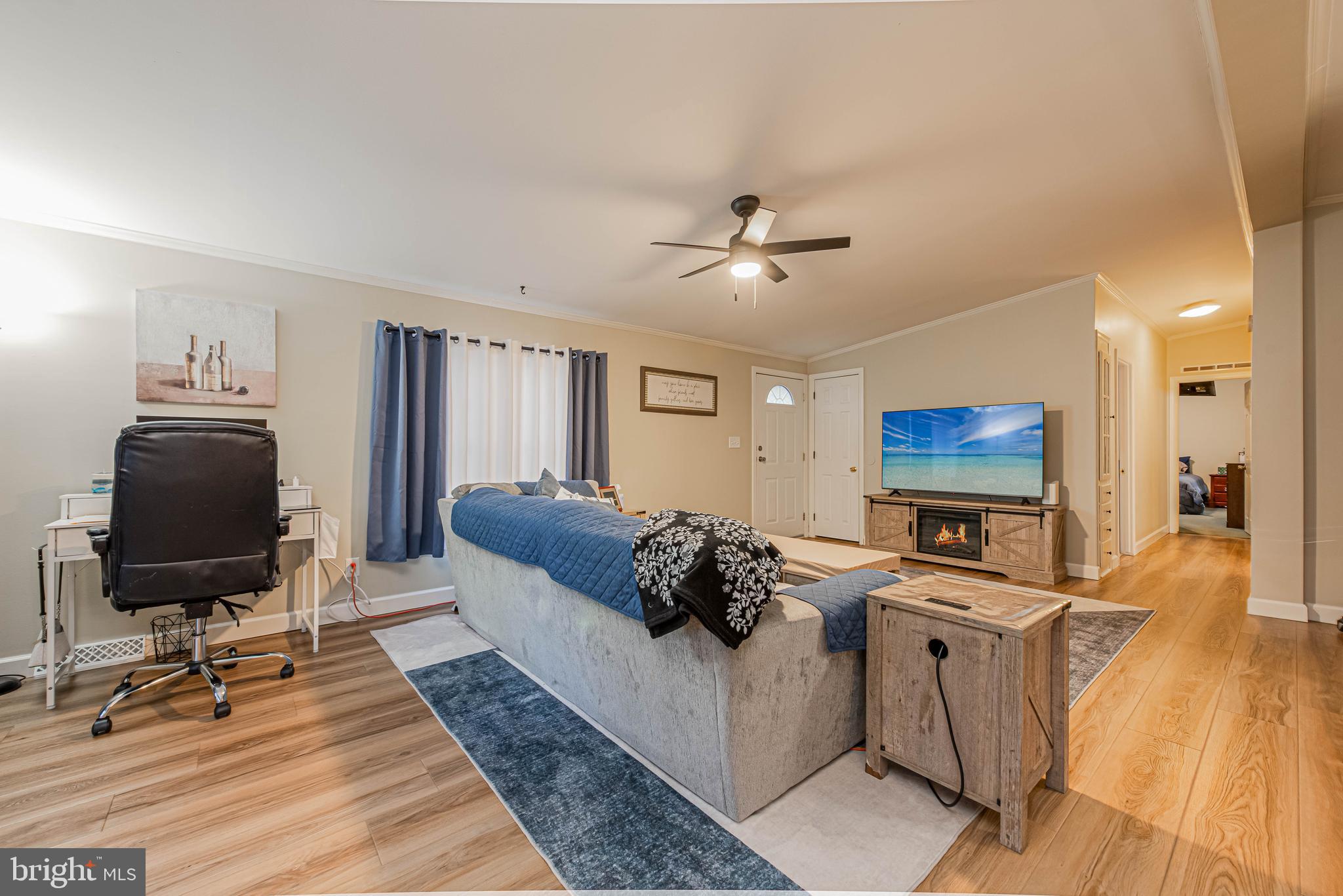 17282 Ridge Line Drive Lewes, DE 19958 - Photo 7 of 31 a living room with furniture and a flat screen tv