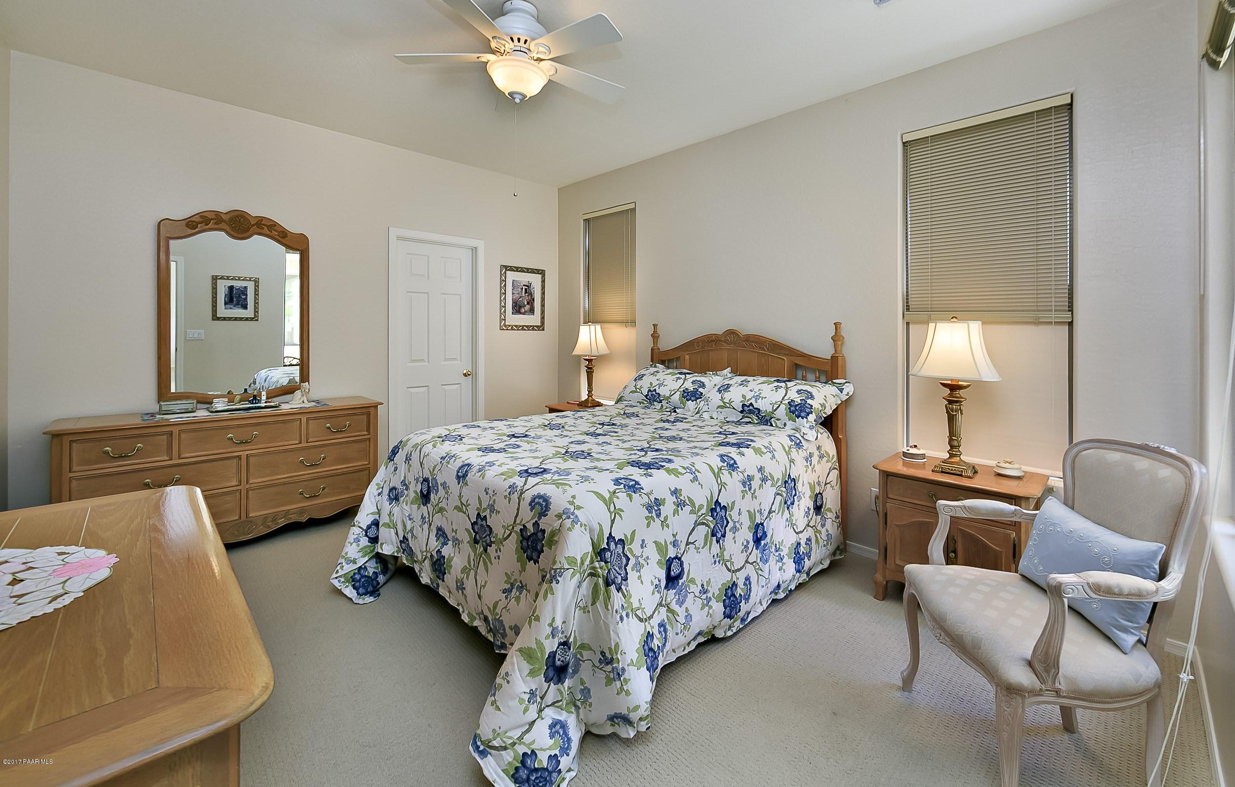 7234 Woolsey Ranch Road Prescott Valley, AZ 86314 - Photo 8 of 23 a bedroom with bed and window
