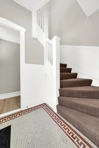a view of staircase with white walls