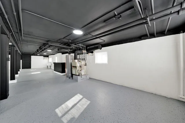 a view of empty room with wooden walls