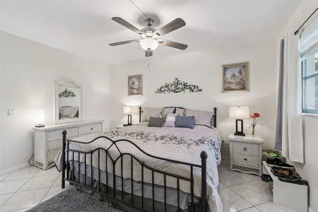 a bedroom that has a bed and a table in it