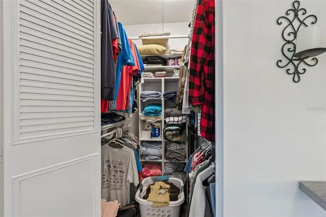 a view of a closet with storage