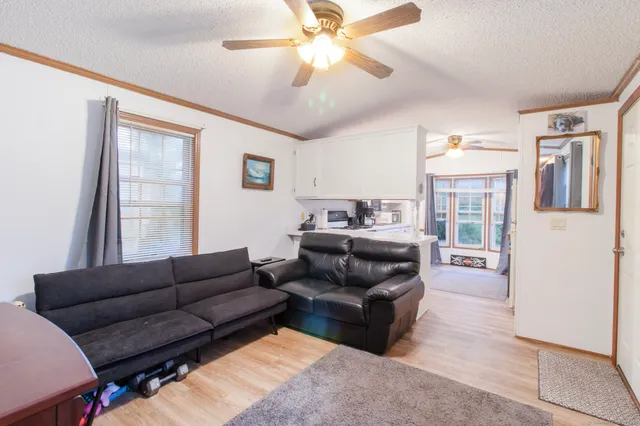 a living room with furniture and a window