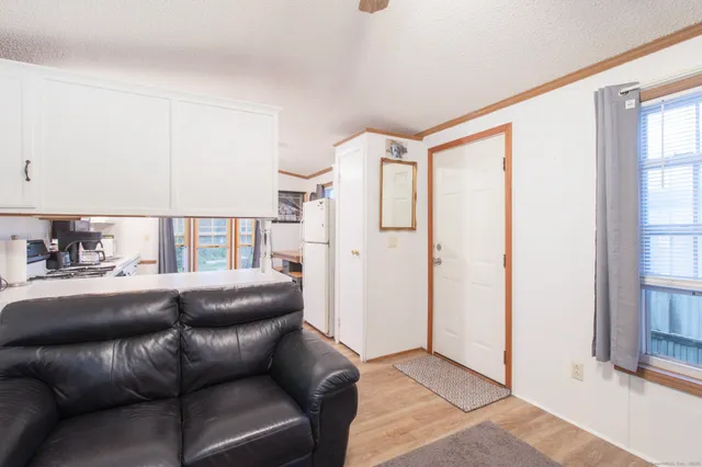 a living room with a couch and a window