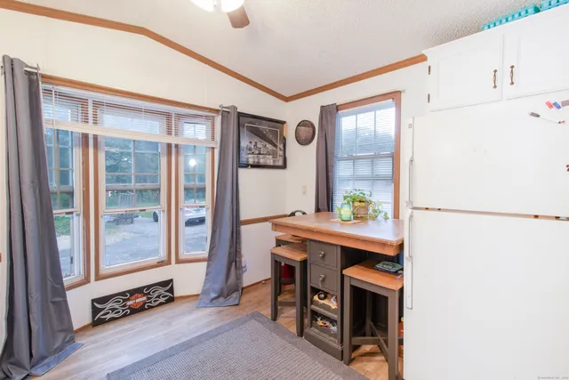 a room with furniture a lamp and a window