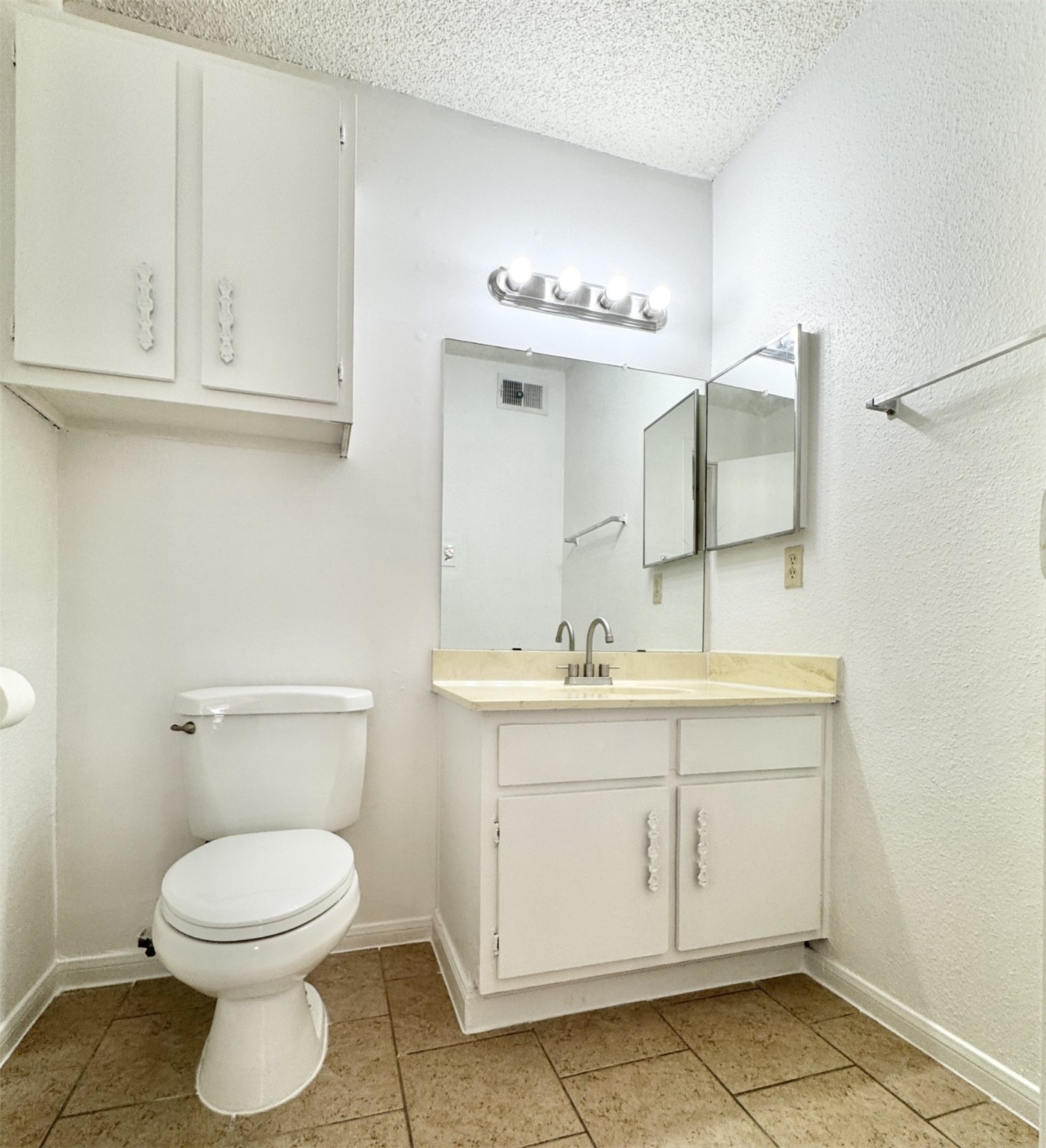 1516 Bay Area Boulevard, Unit U2 Houston, TX 77058 - Photo 11 of 15 a bathroom with a toilet sink and mirror