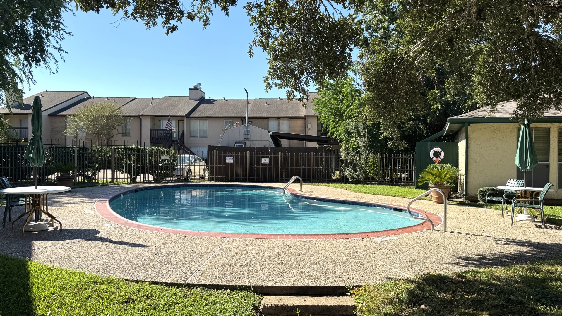 1516 Bay Area Boulevard, Unit U2 Houston, TX 77058 - Photo 2 of 15 a view of a house with swimming pool and sitting area