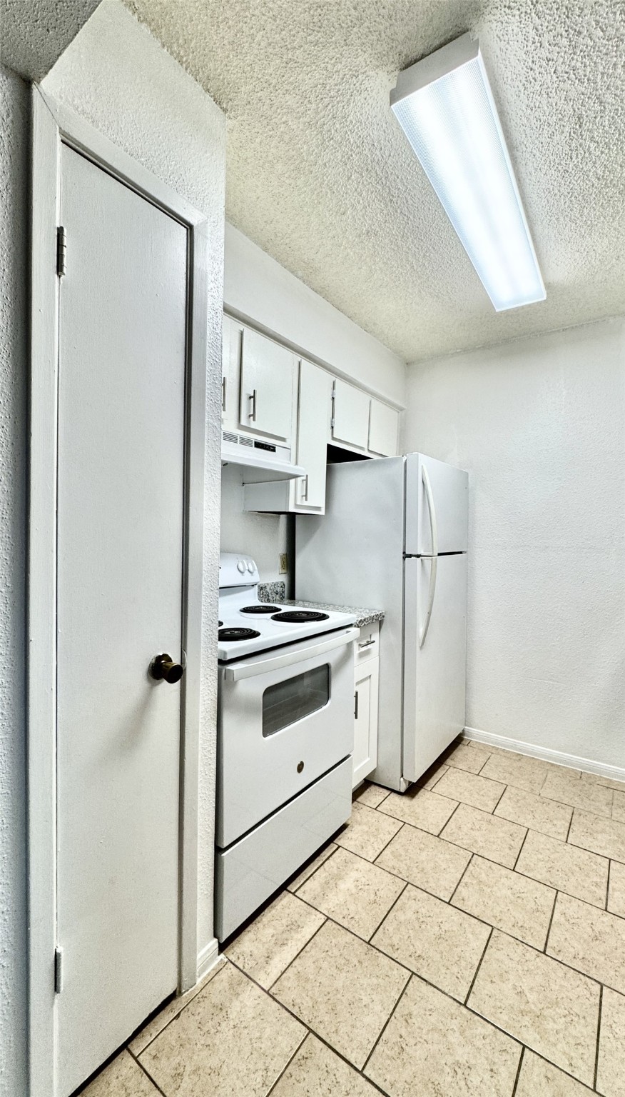 1516 Bay Area Boulevard, Unit U2 Houston, TX 77058 - Photo 8 of 15 a kitchen with stainless steel appliances a refrigerator sink and cabinets