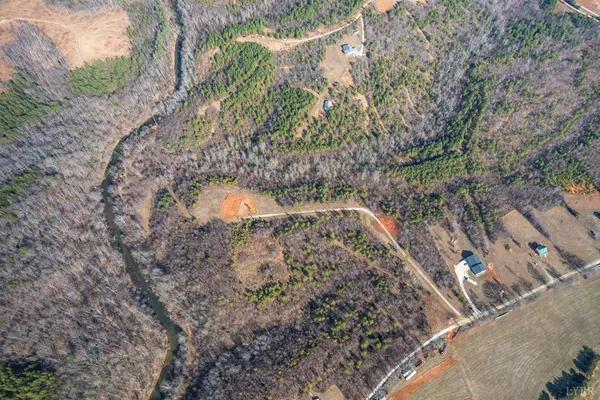 a view of a yard with a tree