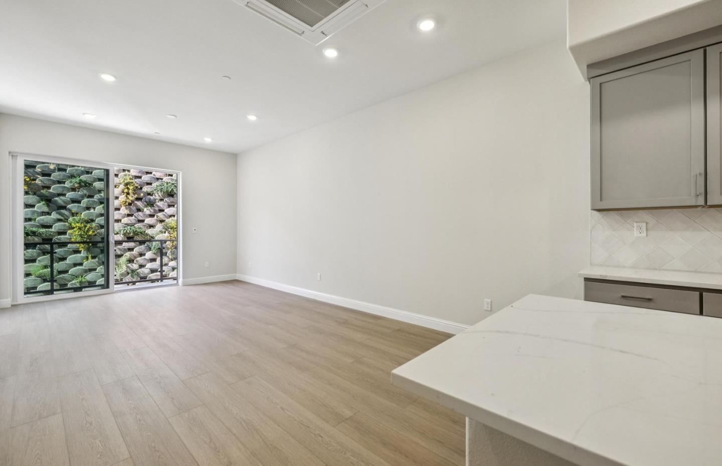 2417 Willow Way San Mateo, CA 94403 - Photo 12 of 34 a view of an empty room with wooden floor and a window