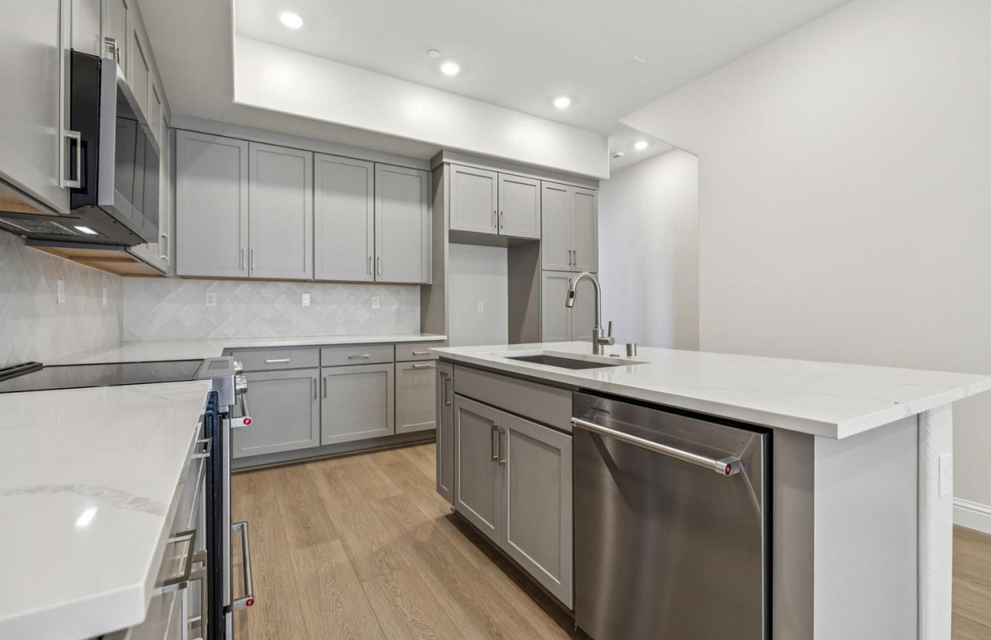 2417 Willow Way San Mateo, CA 94403 - Photo 14 of 34 a kitchen with a sink window and cabinets