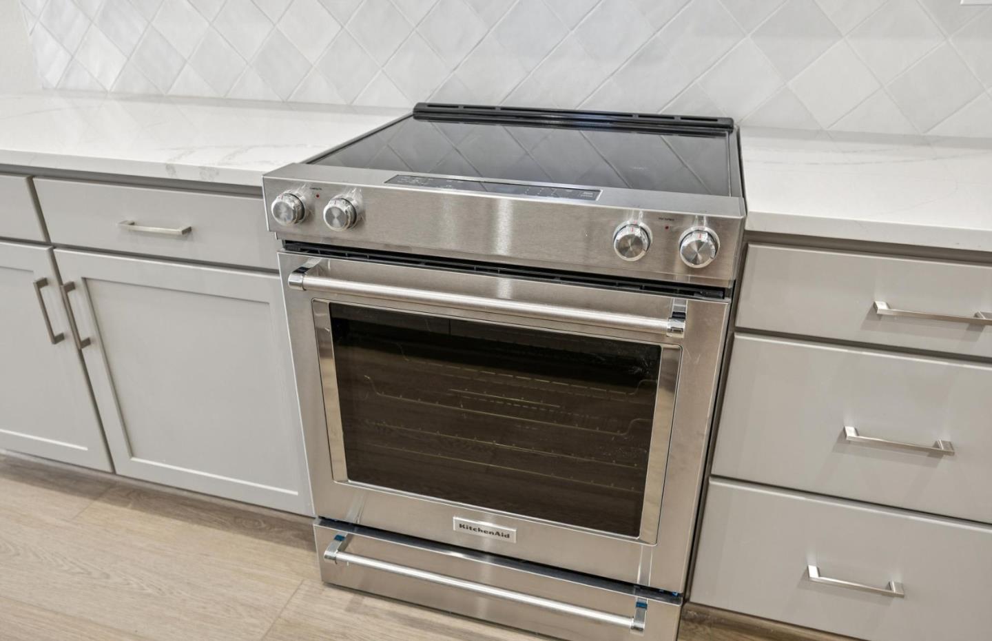 2417 Willow Way San Mateo, CA 94403 - Photo 16 of 34 a stove top oven sitting inside of a kitchen