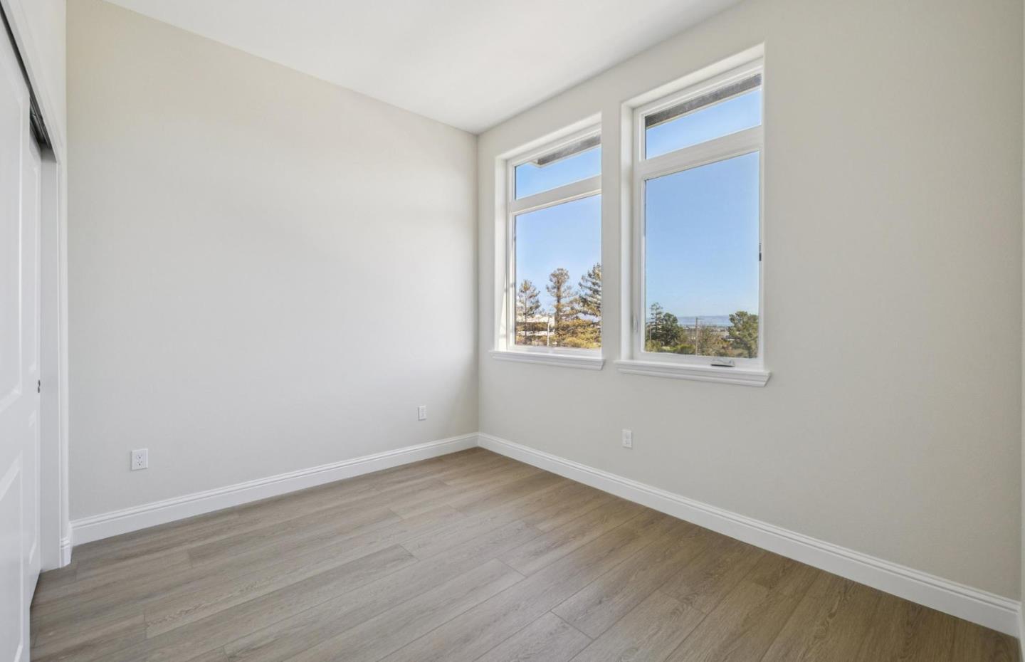2417 Willow Way San Mateo, CA 94403 - Photo 18 of 34 wooden floor in an empty room with a window
