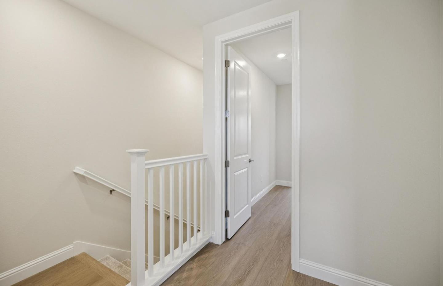 2417 Willow Way San Mateo, CA 94403 - Photo 24 of 34 a view of a hallway with wooden floor