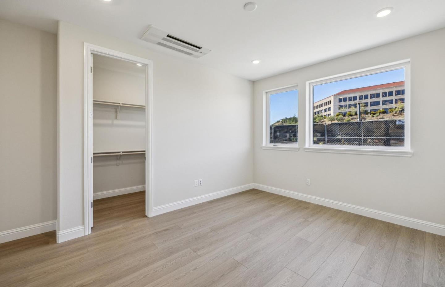2417 Willow Way San Mateo, CA 94403 - Photo 26 of 34 a view of an empty room with wooden floor and a window
