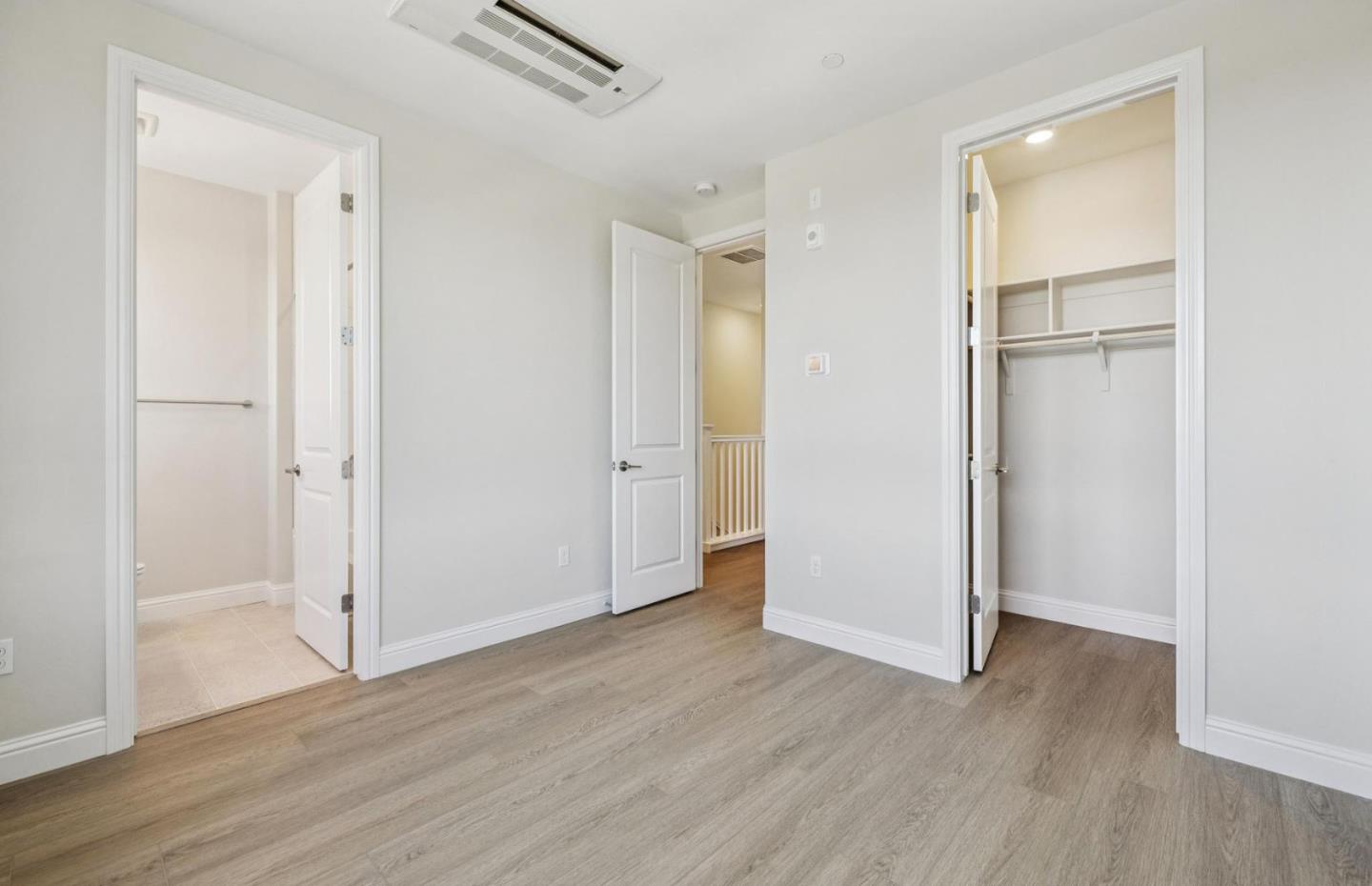 2417 Willow Way San Mateo, CA 94403 - Photo 34 of 34 an empty room with wooden floor & closet and windows