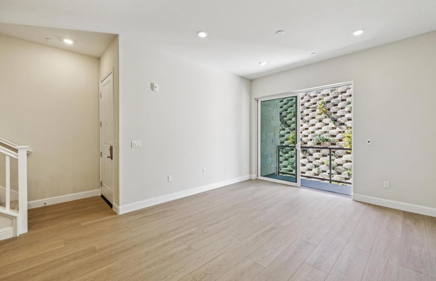 2417 Willow Way San Mateo, CA 94403 - Photo 5 of 34 an empty room with wooden floor and windows